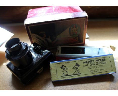 Mickey Mouse twelve glass slides and metal toy projector in original box, slides by Ensign Ltd