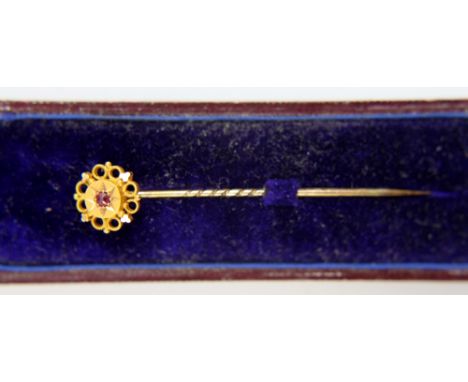 Yellow metal tie pin with centre ruby stone