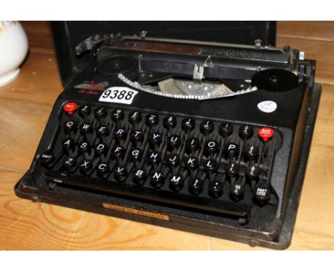 Baby Empire De ~ Luxe vintage typewriter, portable in metal case c1950s, supplied by Catling Hadley Typewriter Co, Manchester
