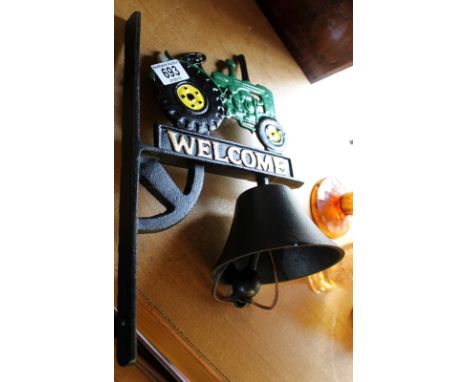 Cast iron wall mounted bell with tractor detail
