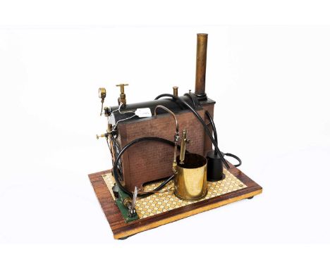 made by C H Nichols 1964 with 8" beam and governor mounted on decorative pillared stand with water feed tank underneath, twin