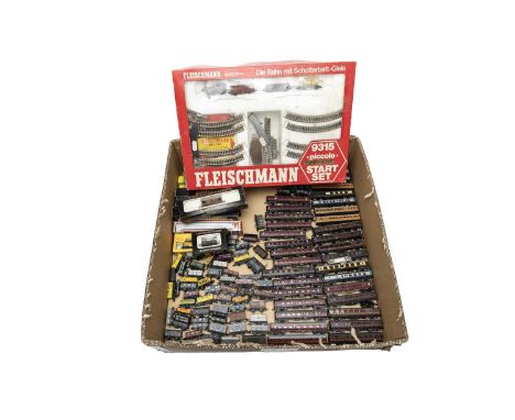 including 30 boxed coaches/wagons, a quantity of unboxed examples, Fleischmann Starter Set (boxed) a box of empty boxes and o