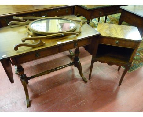 A reproduction mahogany sofa table with centre stretcher and two drawers, an oval mahogany swing toilet mirror (damage to fra