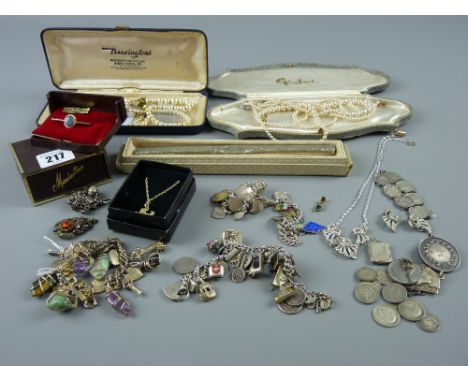 A parcel of mixed jewellery including silver charm bracelets, a yellow metal bar brooch with Australian opal, a coin bracelet