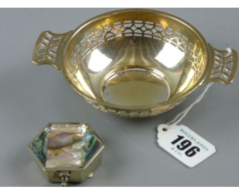 A small circular pierced bowl with twin handles, 1.4 troy ozs, Birmingham 1945 and a white metal and abalone lidded hexagonal