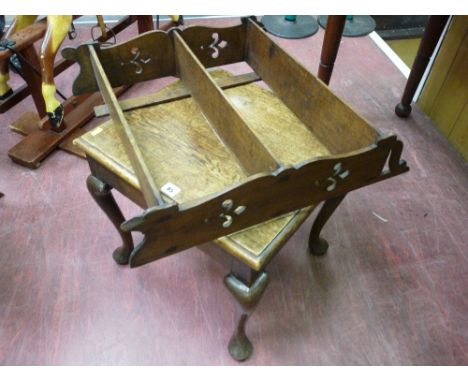 An early oak side table or stand, rectangular top with moulded edge, peg jointed lower section on a dog bone chamfered leg, 4