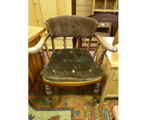 A late 19th Century smoker's bow armchair, cane seated with additional button upholstered pad and back