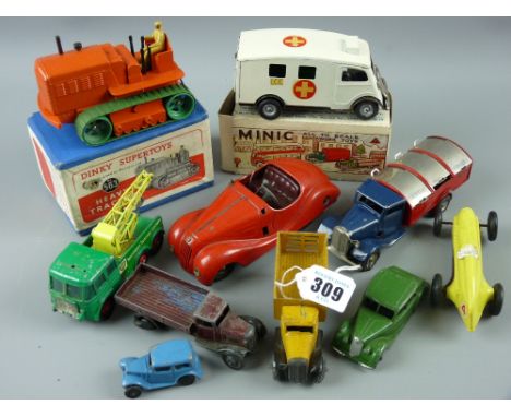 Dinky, Minic, Schuco, Triang diecast and tinplate vehicles to include a mint and boxed Dinky Supertoys heavy tractor no. 563,