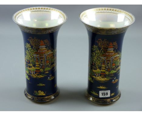 A pair of Carltonware Pagoda Vases, richly decorated in enamel colours and gilt highlighting, early 20th Century Carltonware 