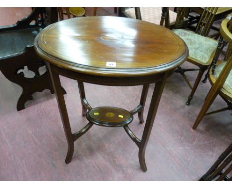 A circa 1900 Sheraton revival inlaid mahogany side table, oval top with central fan inlay and under tier shelf with boxwood i