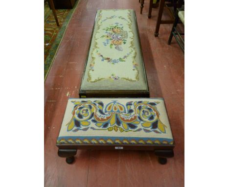 A small oblong polished tapestry top footstool with cabriole supports and a longer mahogany footstool with floral tapestry to