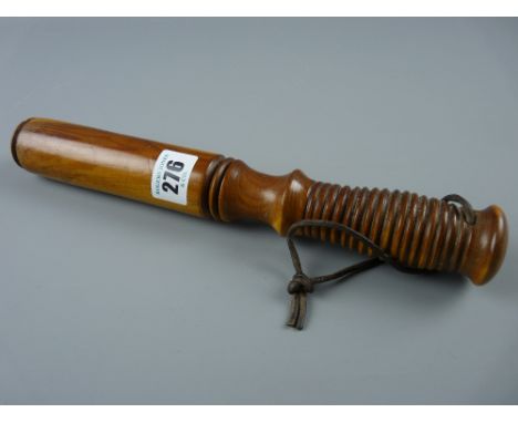 A 20th Century yew wood tipstaff with ring turned grip and leather lace strap, 28.5 cms long