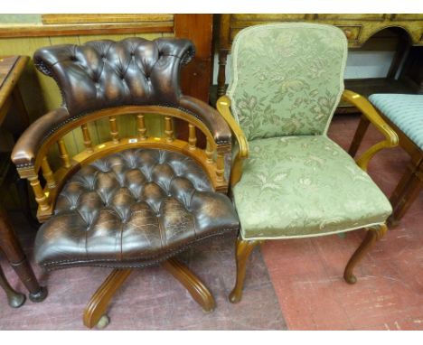 A reproduction button leather effect captain's office chair, 63 cms wide and a walnut upholstered armchair with carved knee Q