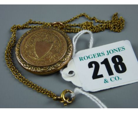 A nine carat gold front and back circular photo locket with nine carat gold link chain, 7.5 grms gross