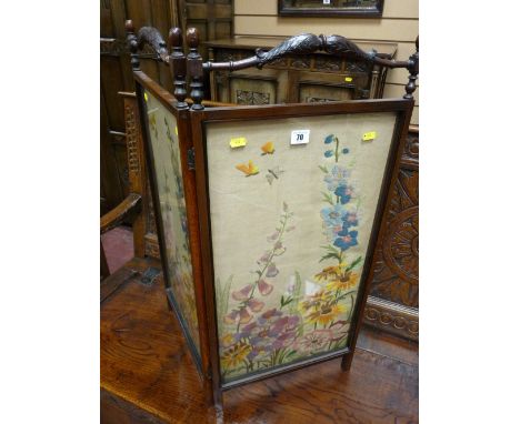 A circa 1900 two fold mahogany firescreen having carved top handles with block and turned side supports, two glazed lower pan