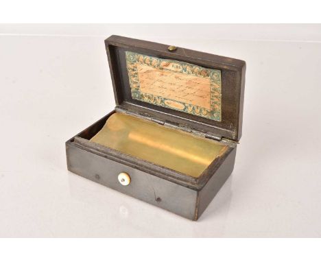A Bakelite Musical Snuff Box, having embossed image of 'The Last Supper' to the top of the lid, containing a 4 Air Mechanism,