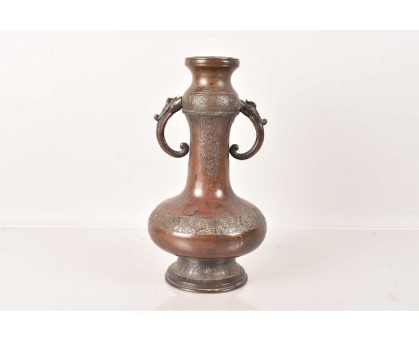 A Chinese Bronze Twin Handle Vase,  having shaped twin handles, with decorative panels and strip, with three large character 