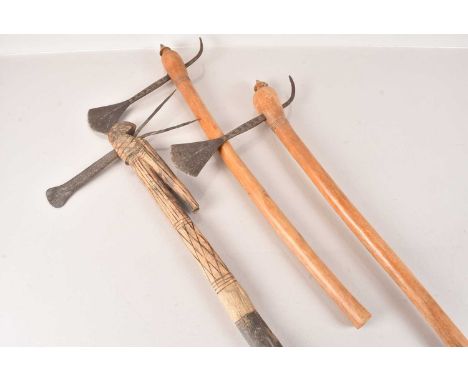 A pair of larger Shona Axes, having geometric design to blade, together with another Shona Axe (3) no postage for this lot, w
