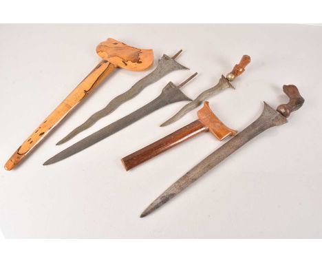 A group of four Kris knives, various sizes and condition, some missing handles/grip, a couple without scabbards (4) no postag