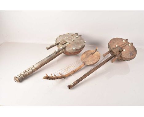 Two African Kora Lutes, one six string, the other eight, together with another stringed musical instrument (3)