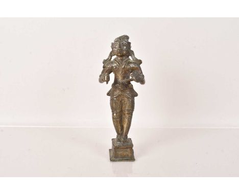 A scarce 19th Century Indian Bronze of Arjuna, depicting the Hindu Warrior Prince Arjuna, typically holding swords and shield