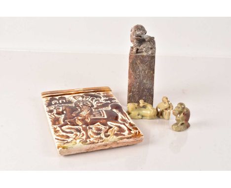 A Soapstone Foo Lion Seal, 18cm H, having character engraved to the front panel and the base, together with three green soaps