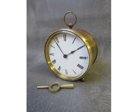 A 19th century circular brass cased 8 day carriage clock with key 