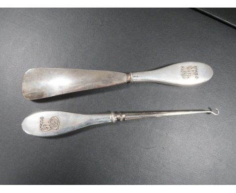 A hallmarked silver handle button hook and shoehorn of large proportions (2) 