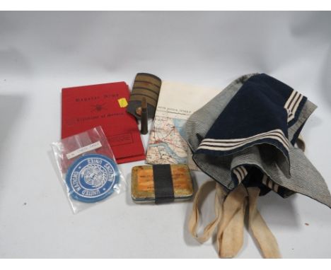A box of military collectables, to include two army certificates of services, Naval items etc.