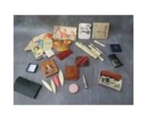 A COLLECTION OF VINTAGE SEWING ACCESSORIES, to include three bone and mother of pearl bobbins, a selection of needle books, a