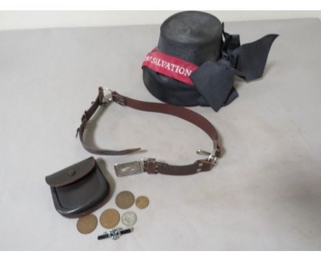 A vintage Salvation Army hat together with a vintage Girl Guide leather belt 