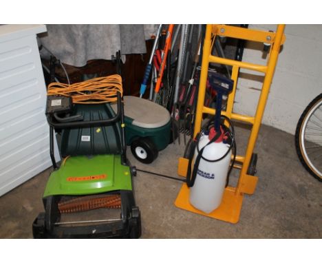 A selection of garden tools to include an electric lawn rake and a sack truck 