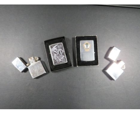 Four vintage Zippo lighters 