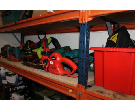 A selection of electrical garden items to include a chainsaw and hedge trimmers etc 