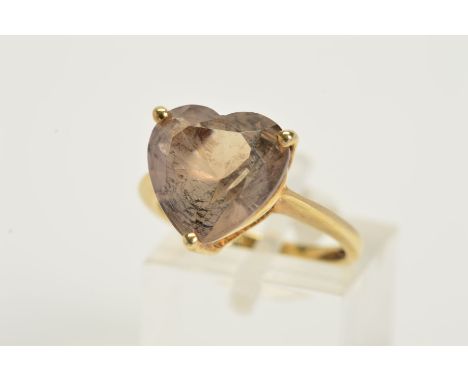 A 9CT GOLD SMOKEY QUARTZ RING, the smokey quartz of heart shape outline within a three claw setting, with 9ct hallmark, ring 