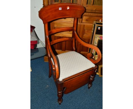 A GEORGIAN WALNUT COMMODE ARMCHAIR