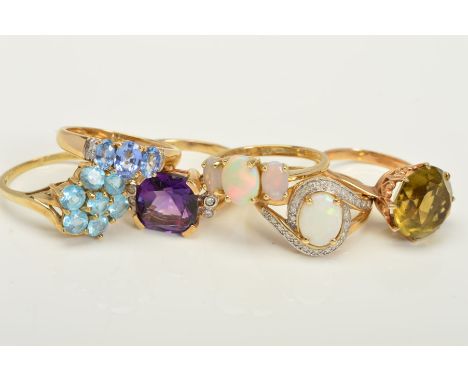 SIX SEMI PRECIOUS GEMT SET DRESS RINGS, to include diamond, amethyst, opal, quartz and tanzanite gemstones, all hallmarked 9c