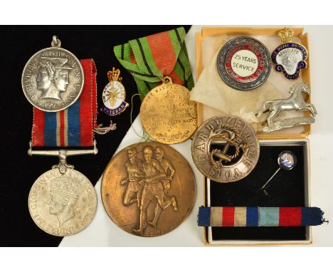 A SELECTION OF MEDALS AND BADGES, to include a 1939-1945 war medal with ribbon, a silver enamel cap badge for 25 years servic