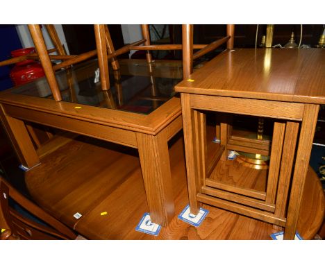 AN ERCOL GOLDEN DAWN ASH GLASS TOPPED COFFEE TABLE and a nest of three tables (2)