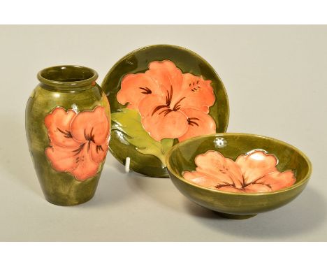 THREE PIECES MOORCROFT POTTERY, 'Hibiscus' pattern on green ground, to include small vase, height 10.5cm, small footed bowl, 