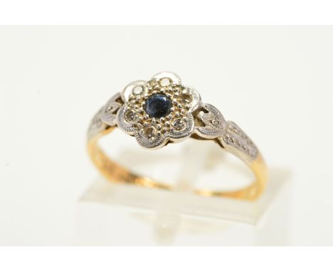 A SAPPHIRE AND DIAMOND CLUSTER RING, designed as a central circular sapphire within a single cut diamond surround, stamped 18