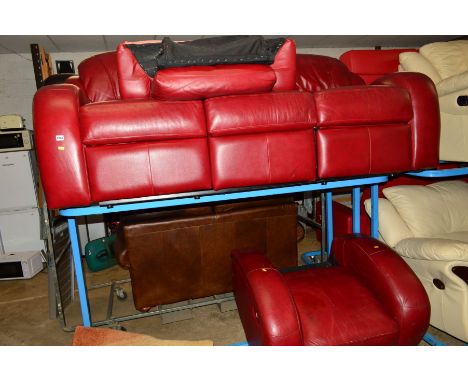 A RED LEATHER RECLINING TWO PIECE LOUNGE SUITE, comprising of a three seater settee and an armchair together with a grey pouf