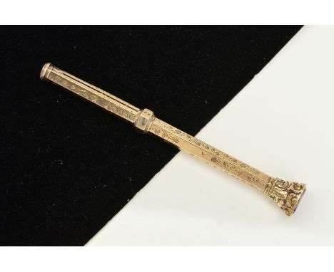 AN EARLY 20TH CENTURY RETRACTABLE PENCIL, with engraved scrolling foliate decoration and shield shaped amethyst terminal, ret