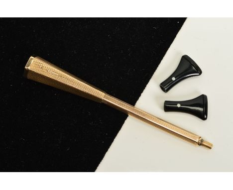 A 9CT GOLD CIGARETTE HOLDER, of hexagonal design with engine turned detail, with two detachable mouth pieces, with 9ct hallma