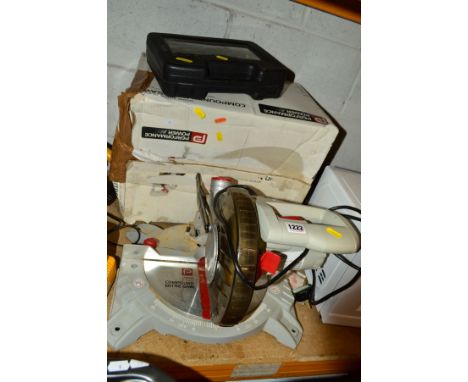 A BOXED PERFORMANCE POWER COMPOUND MITRE SAW and a boxed electric stapler/nailer