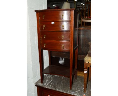 AN EDWARDIAN MAHOGANY AND INLAID FOUR DOOR MUSIC CABINET on square tapering legs united by an under shelf, width 48cm x depth