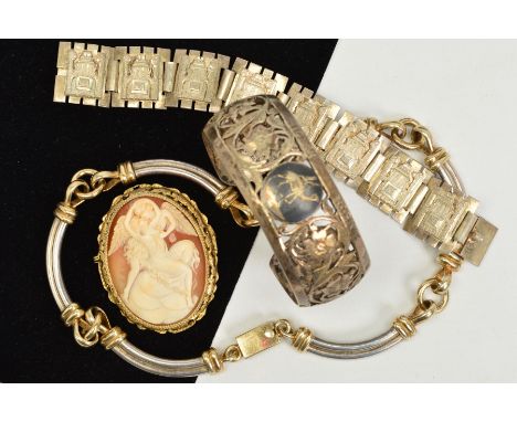 FOUR ITEMS OF JEWELLERY, to include an oval cameo brooch, a bangle with pierced floral and foliate detail, a continental pane