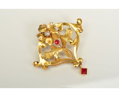 AN EARLY 20TH CENTURY RUBY AND SEED PEARL FLORAL DESIGN BROOCH, measuring approximately 32mm x 32mm, tested as approximately 