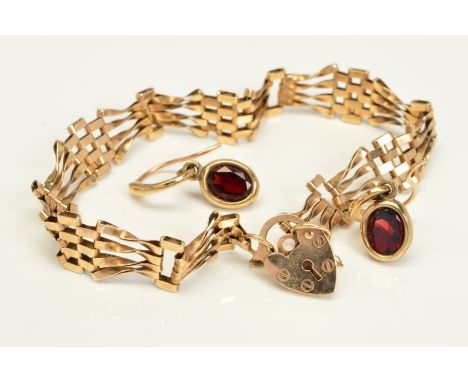 A 9CT GOLD FOUR BAR GATE BRACELET, with padlock and safety chain, measuring approximately 160mm in length, hallmarked 9ct gol