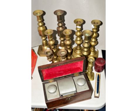 A TEA CADDY, fitted metal interior, with carry handle, length 22cm x width 11cm, together with five pairs brass candlesticks 